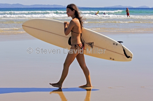 surfer;surfer girl;byron bay;byron bay surfer;woman with surfboard;woman surfer;surfer at byron bay;clarkes beach;australian surfer;steven david miller;natural wanders