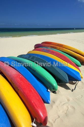 moreton island;moreton island national park;sand island;colourful colorful kayaks;kayaks on a beach;beach with boats;queensland island;tangalooma resort