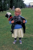 little-girl-holding-pet;little-girl-holding-lamb;school-fete;new-zealand-girl;girl-in-new-zealand