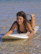 woman-on-surfboard;woman-surfer;woman-lying-on-surfboard;woman-paddling-surfboard;byron-bay-surfer